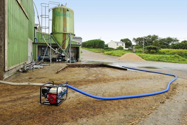 Transferring contaminated water for agriculture using an SDMO water pump